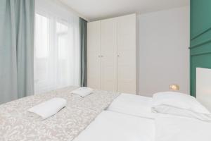 Postel nebo postele na pokoji v ubytování Apartamenty Letnicka by Noclegi Renters