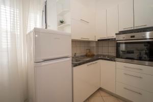 Kuchyň nebo kuchyňský kout v ubytování Apartment N central
