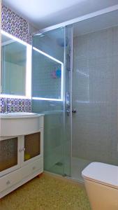 a bathroom with a shower and a toilet and a sink at Sea Views and big balcony in Torremolinos
