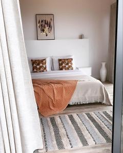 Postel nebo postele na pokoji v ubytování north&south views calheta