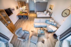 an overhead view of a living room with blue furniture at Villa Glückspilz by Schewe in Binz