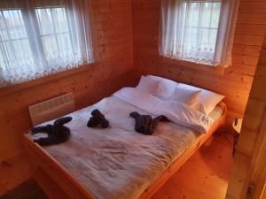 Posteľ alebo postele v izbe v ubytovaní Domek Gucio