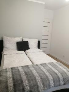 Postel nebo postele na pokoji v ubytování FilMar Apartament przy Parku