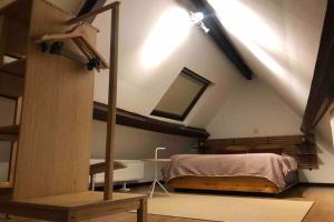 a bedroom with a bed in a loft at Easy comfort in Brussels