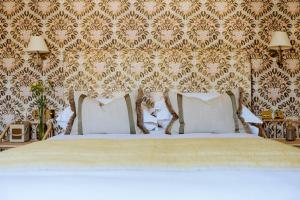 a bedroom with a bed with two pillows at The Yard in Bath Hotel in Bath