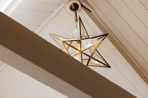 a star chandelier hanging from a ceiling at The Yard in Bath Hotel in Bath