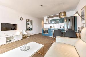 a living room with a couch and a table at Gorgeous apartments with sea view in Callao Salvaje in Callao Salvaje