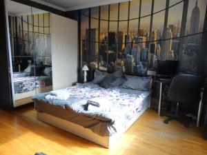 a bedroom with a bed with a view of a city at 2 Bedrooms with private Bath and balcony near the Airport in Sofia