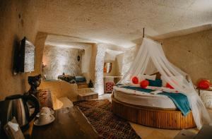 A bed or beds in a room at Prime Cappadocia Suites