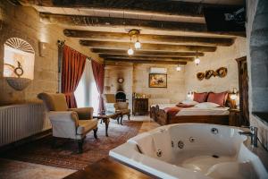 A bed or beds in a room at Prime Cappadocia Suites