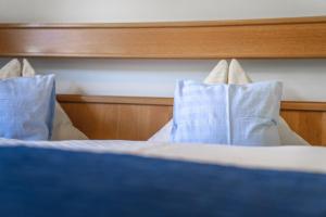 Voodi või voodid majutusasutuse Hotel Landhaus Neumayr toas