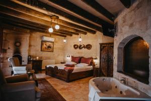 A bed or beds in a room at Prime Cappadocia Suites