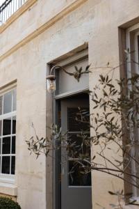a brick building with a door and a window at The Yard in Bath Hotel in Bath