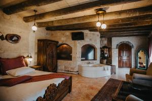 A bed or beds in a room at Prime Cappadocia Suites