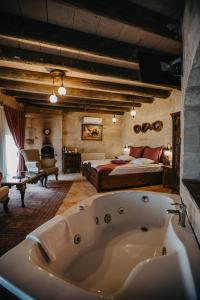 A bed or beds in a room at Prime Cappadocia Suites