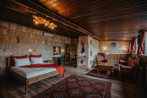 A bed or beds in a room at Prime Cappadocia Suites