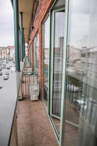 a balcony of a building with a view of a street at Alina Hotel & Hostel in Uzhhorod