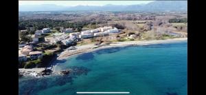an aerial view of a resort on a beach at Résidence Marina Di Bravone in Linguizzetta +156 photos