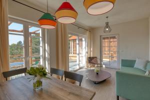 a living room with a table and a couch at Mirandola Suites in Arenzano