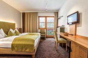 Łóżko lub łóżka w pokoju w obiekcie Aldiana Club Hochkönig