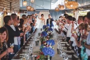 a bride and groom walking down the aisle at their wedding at Hotel Frigopan in Plovdiv