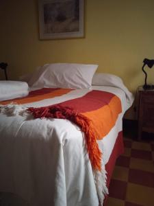 En eller flere senge i et værelse på El Valle Hostería