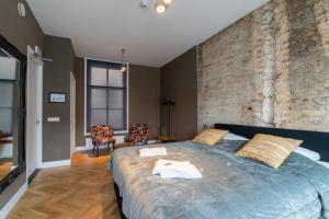 Postel nebo postele na pokoji v ubytování Stadslogement Hoogend