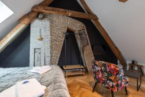 Postel nebo postele na pokoji v ubytování Stadslogement Hoogend
