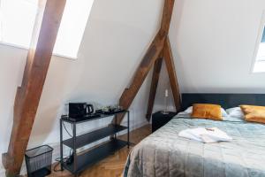 Postel nebo postele na pokoji v ubytování Stadslogement Hoogend
