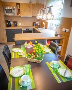 a kitchen with a table with a meal on it at Apartment Haus Maria Waldblick in Burtenbach