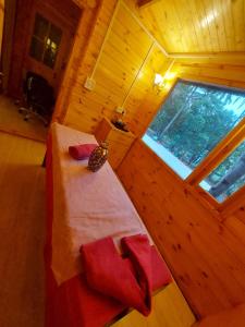 an overhead view of a bedroom with a bed in a wooden room at Adhvasaha Beach Spa Resort in Port Blair