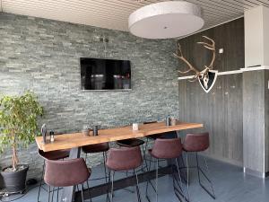 TV a/nebo společenská místnost v ubytování Airporthotel Grenchen