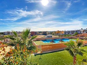 an overhead view of a building with two swimming pools at 3076 Vista azul XXIX in Villamartin