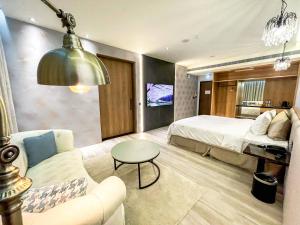 TV a/nebo společenská místnost v ubytování Fifth Avenue Motel + 28 fotografií