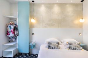 Postel nebo postele na pokoji v ubytování Hôtel Byakko Nice