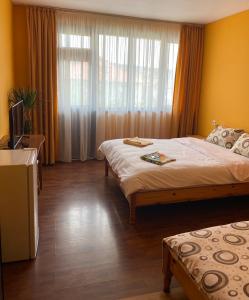 Postel nebo postele na pokoji v ubytování Hotel Chinara