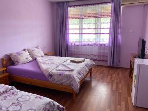 Postel nebo postele na pokoji v ubytování Hotel Chinara