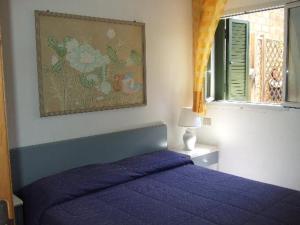 A bed or beds in a room at Punta Ala Flat