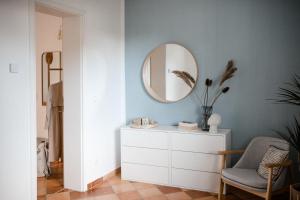 a dressing room with a mirror and a dresser at ☆Reif für die Insel? Cozy Apartment auf Usedom in Ostseebad Karlshagen