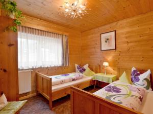 Posteľ alebo postele v izbe v ubytovaní Apartment Comfortappart Eberharter by Interhome + 32 fotografií