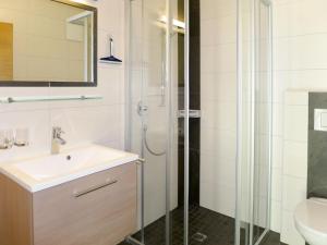 een badkamer met een wastafel en een douche bij Apartment Hanser - MHO752 by Interhome in Ramsau im Zillertal