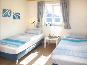 Ένα ή περισσότερα κρεβάτια σε δωμάτιο στο Holiday Home Sanddorn by Interhome