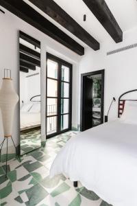 Posteľ alebo postele v izbe v ubytovaní Concepcio by Nobis, Palma, a Member of Design Hotels