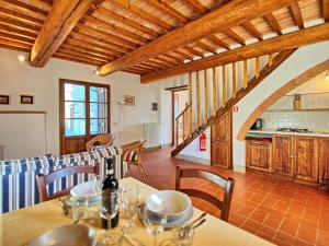 a kitchen and a dining room with a table at Apartment L'Oleandro by Interhome in Grassina