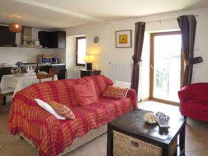 a living room with a couch and a table at Holiday Home Monte Tabor by Interhome in Carmine