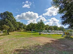 a soccer net in a field with a tent at Apartment Coccinella n-6 by Interhome in Starda