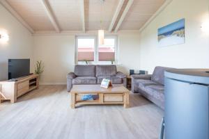 TV a/nebo společenská místnost v ubytování Ferienhaus Strandflieder