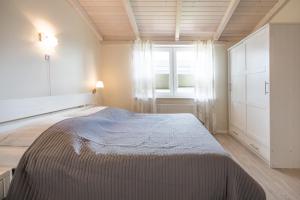 Katil atau katil-katil dalam bilik di Ferienhaus Felsenauster