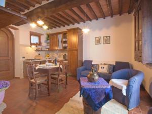 a living room with a couch and a table at Holiday Home Lucia by Interhome in Cortona