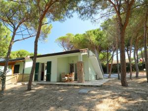 a small house with trees in front of it at Holiday Home San Pietro Blue by Interhome in Codaruina